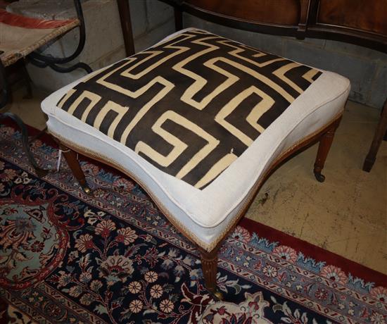 An Edwardian stool upholstered with an African fabric, width 67cm, depth 67cm, height approx. 45cm